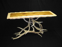 Table with antler base and cherry top